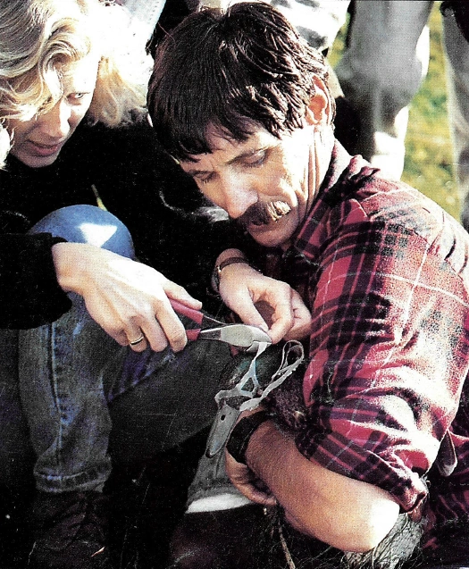 Jeff Marley of Margo Supplies saves Ed the Duck from a plastic ring around it's neck